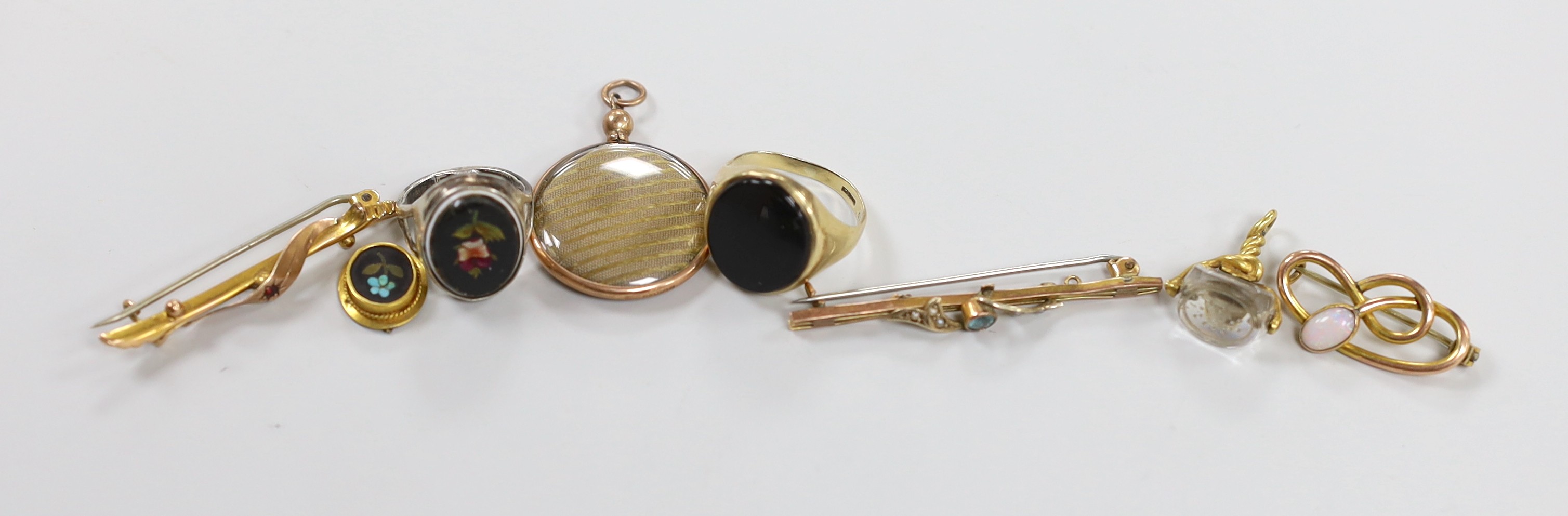 A Victorian yellow metal mounted rock crystal fob seal, 21mm, two yellow metal bar brooches including 9ct gold, an Edwardian Art Nouveau 9ct gold and white opal set scroll brooch by Charles Horner and four other items in